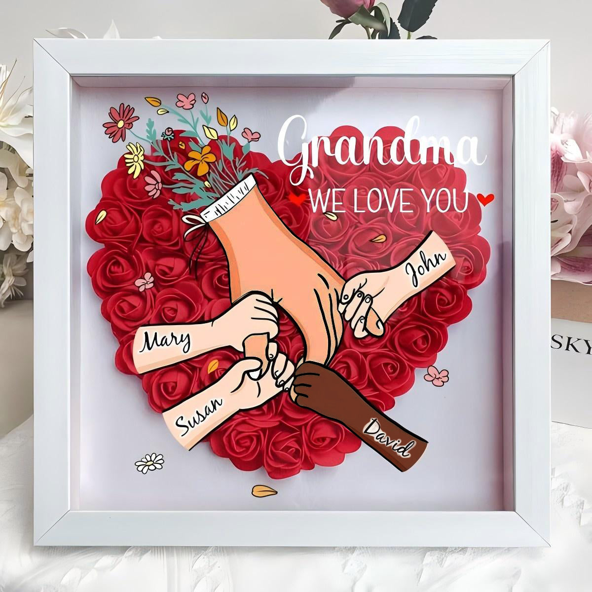 custom-hand-holding-family-flower-shadow-box-with-multiracial-family-different-skin-tones-mother-s-day-gift