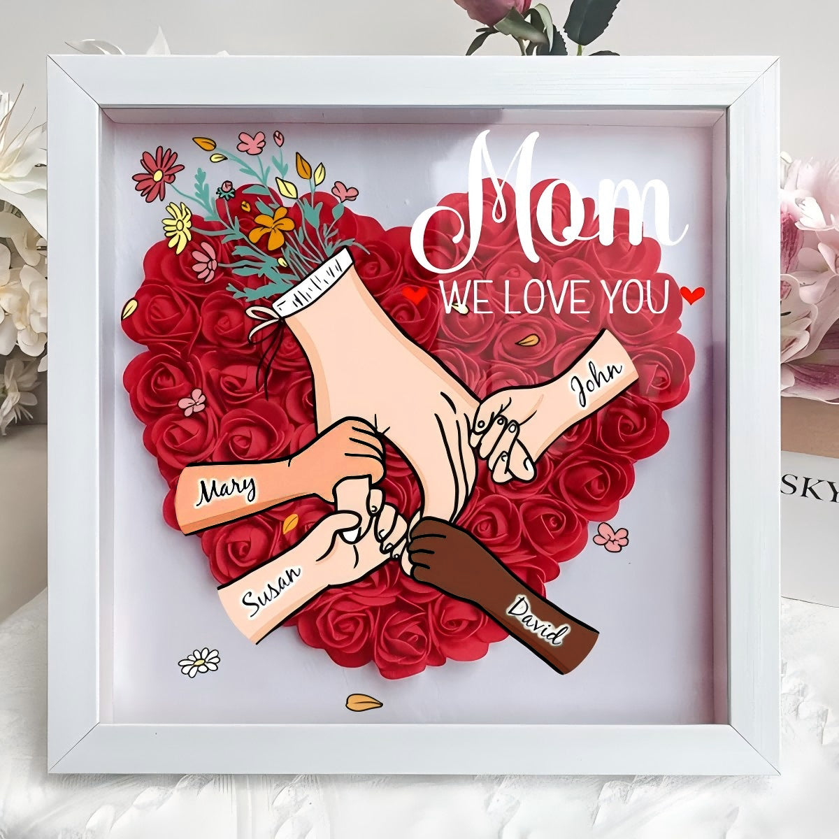 custom-hand-holding-family-flower-shadow-box-with-multiracial-family-different-skin-tones-mother-s-day-gift